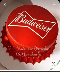 a red cake with the word budweiser on it