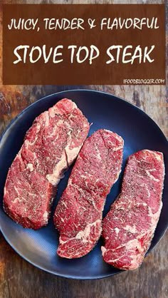 three pieces of raw meat on a blue plate