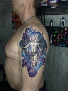 a man with a tattoo on his shoulder