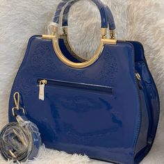 Voodoo Blue Is A Fabulous Sleek Blue And Gold Handbag With Shoulder Straps. Free Gift Included. Blue Tote Bag With Top Carry Handle, Blue Shopping Bag With Top Carry Handle, Blue Bags With Top Carry Handle For Daily Use, Blue Bag With Top Carry Handle For Daily Use, Blue Satchel Shoulder Bag With Adjustable Handle, Blue Top Handle Satchel For Evening, Blue Top Handle Shoulder Bag For Errands, Blue Shoulder Bag With Adjustable Handle For Everyday, Blue Satchel Shoulder Bag For Evening