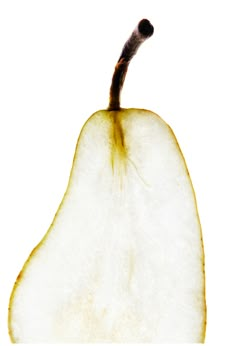 an apple is cut in half on a white background with the peel still attached to it