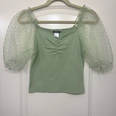 Super Cute Crop Top In Mint Green Or Pistachio. The Sleeves Are Puffy And Sheer. Super Cute For Summer/Spring! Green Puff Sleeve Tops For Spring, Green Puff Sleeve Top With Short Sleeves For Spring, Trendy Green Puff Sleeve Top For Spring, Cute Green Spring Blouse, Green Puff Sleeve Top For Party, Fitted Light Green Top For Spring, Chic Green Puff Sleeve Fitted Top, Chic Green Fitted Puff Sleeve Top, Chic Fitted Green Puff Sleeve Top