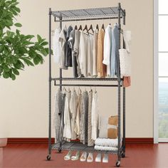 a metal rack with clothes and shoes on it