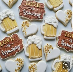 decorated cookies are arranged in the shape of beer mugs