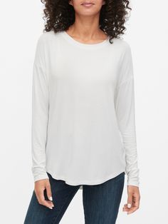 Luxe Tunic T-Shirt | Gap Factory Comfortable White Stretch Top, Versatile White Long Sleeve Knit Top, White Long Sleeve Versatile Knit Top, Fall Comfortable White Top, Comfortable Crew Neck Tops For Layering, Versatile Crew Neck Tops For Fall, Versatile Relaxed Fit T-shirt For Fall, Versatile Crew Neck Tops For Everyday, Casual Long Sleeve Top With Shirttail Hem