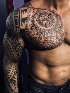 a man with many tattoos on his chest