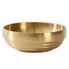 a brass bowl on a white background