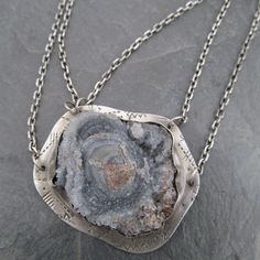 "Large Druzy Pendant Chalcedony Rose Necklace Sparkling Raw Gemstone Neckpiece: This is a stunning, one-of-a-kind neckpiece featuring a natural, raw, sparkling Chalcedony \"rose\" also known as \"Desert Rose\", is hand set on a stamped backplate and suspended from a sterling silver chain that's approximately 18 3/4\" in length. The stone is a sparkly gray with hints of pale blue and cream. Pendant measures approximately 1 1/2\" by 1 3/4\". All handmade in my little home studio. Enter my shop: ht Antique Silver Necklace For Healing, Vintage Sterling Silver Necklace With Large Stone, Unique Natural Stones Necklace For Wedding, Spiritual Jewelry With Large Stone Pendant, Spiritual Large Stone Pendant Jewelry, Spiritual Pendant Jewelry With Large Stone, Antique Pendant Necklace With Natural Stones, Antique Natural Stone Pendant Necklace, Antique Natural Stone Pendant Jewelry