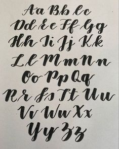 some type of calligraphy that is black and white with the letters written in cursive