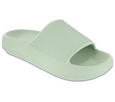 a women's slipper in light green with white soles and an open toe