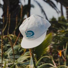 The ever-popular nylon surf hat, ideally suited for your next painting project. Mid profile, unstructured snapback cap Light weight, quick-dry 100% Nylon One size fits all Illustrated by Sam O'Brien