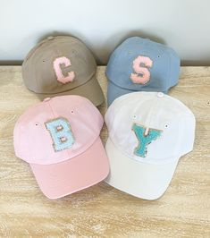 We have had so many request for youth size hats, they are finally here. Youth size baseball Cap with your choice of Varsity Chenille Letter Patch. Patch is applied with industrial heat. These are Youth size!! 100% bio-washed chino twill Unstructured, six-panel, low-profile Pre-curved visor Self-fabric tri-glide buckle closure Tear away label MeasurementsSmall Fit: 6½ - 7¼ Sizes (US)Adjustable (age range: 5 years to small adult) Elena Belle, Womens Ball Caps, Patches Ideas, Monogramming Ideas, Purple Petunias, Cricut Projects Easy, Monogram Hats, Creative Dates, Kids Baseball Caps