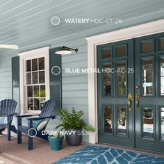 a porch with two chairs and a table on the front steps, next to a blue door