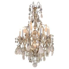 a chandelier with many crystal pieces hanging from it