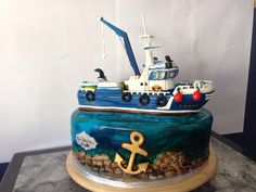 a cake with a boat and an anchor on it