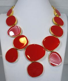 "This signed Kenneth Lane necklace has red enameled multi-shaped disks in a gold tone setting. The necklace measures 18-1/2\" long and 5\" wide at front center. It has a gold chain with a hook clasp. A single disk is 1-1/2\" in diameter. This necklace is signed Kenneth Lane and is in excellent condition." Red Enamel Round Necklace, Formal Red Enamel Necklaces, Formal Red Enamel Necklace, Gold Enamel Necklace For Party, Gold Enamel Party Necklace, Stone Statement Necklace, Bib Necklaces, Hook Clasp, Creative Jewelry