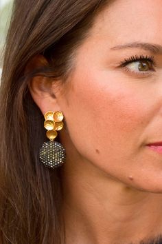 Discover elegance with the Lani Earrings. The signature multi-circle design is plated in gold, while the rhinestone dangle adds a touch of sparkle. Lightweight, nickel, and lead-free, these earrings are both fashionable and comfortable. Gold Crystal Earrings With Bling, Luxury Macy's Diamond Accented Earrings, Gold Round Bling Earrings, Gold Cluster Drop Earrings For Evening, Gold Cluster Earrings With Sparkling Stones, Gold Jeweled Round Earrings, Gold Round Linear Earrings For Party, Elegant Gold Cluster Earrings With Sparkling Stones, Gold Brass Crystal Earrings For Party