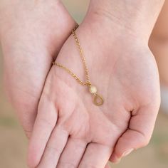 This delicately handcrafted Teardrop Necklace is perfect for layering but makes a statement all on its own. The teardrop pendant is anchored with a small stone as it sits on a delicate, adjustable brass chain. Part of our teardrop collection, this necklace pairs perfectly with our Teardrop studs, Teardrop hoops, or Teardrop Duster earrings. This necklace is handmade in our India Sanctuary. Wear or gift this necklace knowing that your purchase is supporting courageous women as they rebuild their Everyday Brass Teardrop Necklace, Everyday Teardrop Brass Necklace, Delicate Adjustable Teardrop Jewelry, Adjustable Minimalist Teardrop Pendant Charm Necklaces, Brass Teardrop Pendant Jewelry With Adjustable Chain, Minimalist Brass Teardrop Pendant Necklace, Adjustable Drop Necklace With Delicate Teardrop Pendant, Delicate Adjustable Drop Necklace, Adjustable Teardrop Brass Necklace