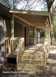 a wooden porch with steps leading up to it