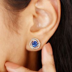 Product Details Mark your anniversary with utmost elegance by adorning these stunning Swirl Stud Earrings. The centerpiece boasts a brilliant Round Shape Created Blue Sapphire, delicately placed in a prong setting, while multiple circles of Diamond embrace it, enhancing its allure and individuality. Product Information SKU SHP-EARRINGS022012470 Length 10.8 mm Width 10.8 mm Weight 2.16 gm (Approximate) LAB CREATED BLUE SAPPHIRE INFORMATION No.of Stones 2 Pieces Total Weight 2.10 Carat (Approximat Sapphire Earrings Studs, Embrace It, Sapphire Earrings, Small Earrings, Prong Setting, Round Shape, Blue Sapphire, Swirl, Sapphire