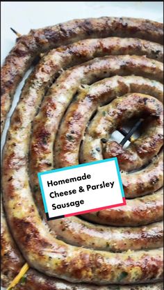 homemade sausage and parsley sausage on a white plate with a blue sticker that says homemade cheese and parsley sausage