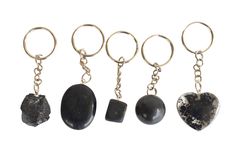 four keychains with different types of rocks and stones hanging from each one's sides