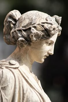 a close up of a statue of a woman's head