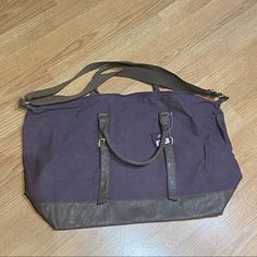 This Gorgeous Tote Bag Is Gigantic! It Can Hold So Much Stuff! It Has Two Handles Or An Adjustable Strap. It Also Has Belt Like Buckles On The Front Which Adjust To Make More Room Also. Purple Cloth Material And Brown Leather Bottom With Matching Brown Leather Handles And Belt Buckles. Satin Fabric On The Inside. Brand New, Never Used. Versatile Purple Tote Shoulder Bag, Tote Bad, Purple Tote Satchel For On-the-go, Purple Cloth, Rectangular Purple Travel Bag For On-the-go, Tan Tote Bag, Beauty Bags, Purple Leather-handled Tote Bag, Suede Tote