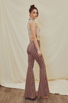 Get wild with our Jaqueline High Rise Super Flare Jeans set in a unique burgundy striped design. Includes back dart detailing to give the perfect fit and lift while ensuring comfort from our stretch denim. Featuring a cut seam at the back of the knee, wide hem, classic front button closure, and zip fly. Rise 11" / Inseam 34" (In size 3/25) 76% Cotton, 5% Polyester, 2% Spandex Model in Size 25 Style # : KC5246BG Stretchiness Level >> Stretch SIZE WAIST HIP 1 / 24 25.5" 32.5" 3 / 25 26.5" 33.5" 5 Chic Striped Fitted Bottoms, Chic Fitted Bottoms With Vertical Stripes, Fitted Pants With Vertical Stripes For Fall, Fitted High Waist Pinstripe Bottoms, Fitted Pinstripe High Waist Bottoms, Chic Stretch Bottoms With Vertical Stripes, Casual Fitted Pants With Vertical Stripes, Striped High-waist Fitted Bottoms, Fitted High Waist Striped Bottoms