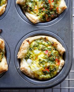 four mini pizzas in a muffin tin