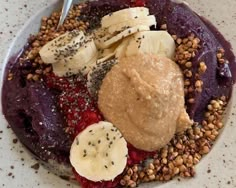 a white plate topped with fruit and nuts