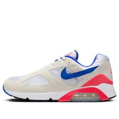 The Nike Air Max 180 'Ultramarine' 2024 is a retro running shoe that pays homage to the iconic OG colorway from the '90s. The upper features a white textile base with off-white suede overlays and a blue leather Swoosh. Bright red accents appear on the TPU heel counter, the 180 Air tongue tag, and the Nike Air branding embroidered on the back heel. The standout feature is the cushioning setup, which boasts 180 degrees of visible Air cushioning. Retro Sneakers With Air Cushioning For Streetwear, Nike Retro Sneakers With Air Max Cushioning, Retro Nike Sneakers With Air Max Cushioning, Retro Air Max Sneakers For Running, Retro Sneakers With Air Max Cushioning For Sports, White Retro Sneakers For Running Errands, Retro White Sneakers For Running Errands, Retro White Sneakers For Errands, Retro Nike Running Shoes With Boost Midsole