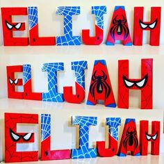 the letters are made out of wood and have spiderman faces on them