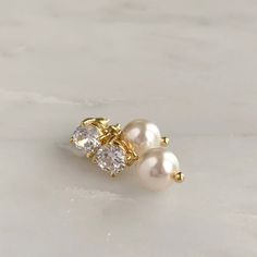 DETAILS:- Available in silver, gold or rose gold - Choose your own pearl color- .75" length- .25" width- Lightweight, easy to wear- Pearl measures 8mm- Nickel and lead free- Securely packaged in a signature gift box- Easy returnsSHOP THE COLLECTION:https://www.etsy.com/shop/TigerlillyCouturePACKAGING:Arrives in a custom Tigerlilly box, perfect for gifting and storing the jewelry.Printed receipts are not included in the box. You may print a receipt directly from Etsy for your records.If it is a g Elegant 14k Gold Filled Jewelry For Wedding, Classic 14k Gold Filled Pearl Earrings, Classic 14k Gold-filled Pearl Earrings, Dainty Pearl White Earrings For Pierced Ears, Elegant 14k Gold-filled Pearl Earrings For Formal Occasions, Formal Gold Pearl Earrings In 14k Gold Filled, Elegant Formal 14k Gold Filled Pearl Earrings, Classic Gold Bridal Earrings, Delicate Gold Pearl Earrings For Anniversary