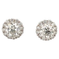 Diamond Stud earrings weighing 3.07 Carats in a 4 prong Champagne Setting, flanked with diamond halo weighing 1.25 carats in 18 Karat White Gold. Color H Clarity SI3-I1 White Color, Clean to the Eye Studs can be sold without halo. Call/Message us to discuss more in detail. Setting can be changed to a Basket, Martini or Champagne/ 3 or 4 Prong/ 14 or 18 Karat. DM for more Info & Videos on my ear. More Diamond Studs Available Search Harbor Diamonds Formal Cluster Diamond Earrings With Brilliant Cut, Formal Vvs Clarity Diamond Cluster Earrings, Gia Certified Cluster Earrings For Formal Occasions, Gia Certified White Gold Cluster Earrings For Formal Events, Gia Certified White Gold Cluster Earrings For Formal Occasions, Cluster Diamond Earrings With Halo Design, Diamond Cluster Earrings With Halo Design, Gia Certified Round Cut Diamond Cluster Earrings, Gia Certified Diamond Cluster Earrings