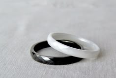 Offered is either a faceted black ceramic band OR a white faceted ceramic ring that have been polished to a fabulous shine! Ceramic is a hard metal that it will never fade, scratch, bend, tarnish, or lose its polish. Additionally, it's hypoallergenic, making it a wonderful choice for a friendship, promise, engagement, and wedding ring! This is a SMALL, minimalist ring - the band width is 2mm. The ring comes in sizes 6, 7, 8, 9, and 10. Please use the drop down menu to select your size and color. Black And White Rings Aroace, Friendship Promise, Black And White Rings, White Rings, Engagement And Wedding Ring, Friendship Ring, Ceramic Ring, Friendship Rings, Hard Metal