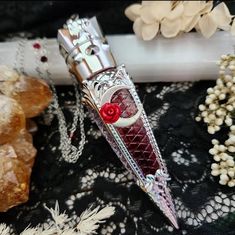 Our 𝕭𝖊𝖑𝖑𝖆 𝖒𝖔𝖗𝖙𝖊 blood vial necklace certainly makes a statement with its large and ornate in your face design now with celestial elements and Swarovski crystal adorned chain Our FAKE BLOOD vial comes pre filled and sealed with our own secret blend of pigments.  All on a stainless steel /or electroplated chain with soldered links for ultimate strength and durability. - 4.5 inch long statement making PLASTIC vial pendant. lightweight and gorgeously detailed.  - Secret formula "vampire bl Vampire Fang Jewelry, Blood Necklace Vial, Vampire Items, Blood Vial Necklace, Blood Jewelry, Jewelry Vampire, Necklace Vampire, Vial Pendant, Vampire Necklace