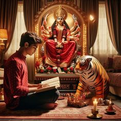 a man sitting on the floor next to a statue of a tiger reading a book