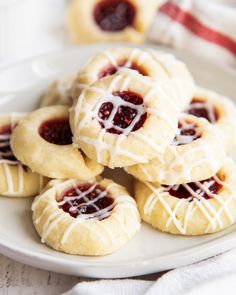 small pastries with jelly filling on a white plate