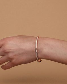 Our Lana Bangle is an essential piece of arm candy that you absolutely need in your jewelry box. Sleek and minimal with the subtle glimmer of the cubic zirconia, this bracelet can accompany you to any event or occasion.Materials 14K yellow gold, rose gold or white gold plated AAAAA Cubic Zirconia Measurements: Width: 64.5mm (2.54”); Height: 57.5mm (2.26”); Thickness: 3.3mm (.13”) Hypoallergenic; nickel, lead, and cadmium free Fashionable Jewelry, Arm Candy, Gold Rose, Jewelry Box, Cubic Zirconia, Gold Plate, Bangles, White Gold, Sleek