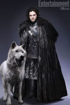 game of thrones poster with white dog and man in black outfit standing next to wolf