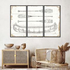 three framed art pieces with arrows on them