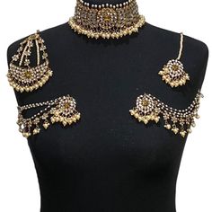 Handcrafted champagne antique golden kundan Indian wedding / bridal jewellery set. Set includes- Earrings with multilayer pearl sahara  Choker necklace Jhumar Tikka  Our choker is adjustable with a dori at the back giving you a comfortable fit. It comes with elegant kundan earrings with pearl detail, tikka and jhumar with hooks.  The subtle glimmer of the kundan with elegant pearl detail makes this jewelry set a truly head turning piece, a must have for every jewellery box.  Our ethnic jewellery Bollywood Style Gold Bridal Necklace For Reception, Gold Bollywood Bridal Necklace For Reception, Gold Kundan Bridal Necklace For Reception, Gold Bridal Sets For Reception And Festivals, Gold Bridal Sets For Reception And Diwali, Gold Kundan Necklace For Reception, Festive Gold Kundan Necklace For Reception, Gold Bollywood Bridal Necklace For Party, Gold Bridal Sets With Meenakari For Reception