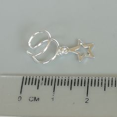 Star charm dangler, open ended sterling silver ear cuff. Dimensions: 6 x 8 mm Star: 8 x 8 Weight: .90gm Price listed is for ONE PIECE These are made of 925 hypoallergenic sterling silver. pieces come with a 925 stamp. Can be packaged in a gift box. I can include a personal message from you if needed You are welcome to contact me at... bhavnakwintra1956@gmail.com For more beautiful pieces from my shop, please browse 👇 TOE RINGS: https://www.etsy.com/your/shops/TheSilverGame/tools/listings/sectio Silver Star-shaped Ear Cuff As Gift, Silver Star-shaped Ear Cuff For Gift, Silver Star Shaped Ear Cuff As Gift, Silver Star Shaped Ear Cuff Gift, Sterling Silver Star Charm Cartilage Earrings, Sterling Silver Star Cartilage Earrings With Star Charm, Silver Nickel-free Ear Cuff Gift, Silver Nickel-free Ear Cuff For Gift, Adjustable Silver Ear Cuff With Ear Wire