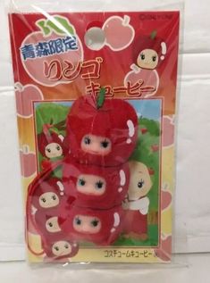 a package of red apples with japanese characters on them