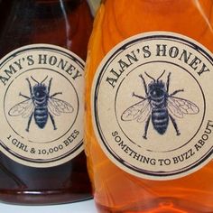 two bottles of honey sitting next to each other