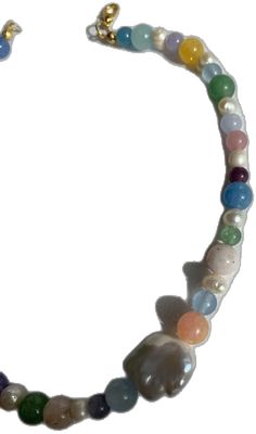 a necklace with multicolored beads and charms