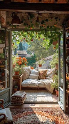 an open room with lots of furniture and flowers on the ceiling, in front of a window