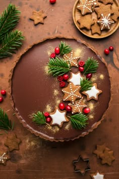 a chocolate tart decorated with christmas decorations