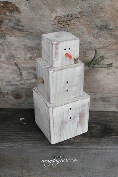 three snowmen are stacked on top of each other